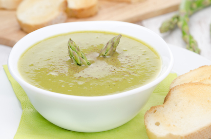 cream soup of asparagus and green peas close-up