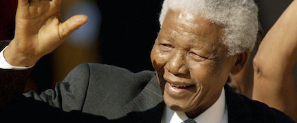 Former President Nelson Mandela waves at the crowd on arrival at the inauguration ceremony at the Union Building in Pretoria. South Africa.
