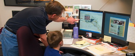 Father showing his son what he does at work for the Ada County Highway District in Boise Idaho. Image shot 04/2008. Exact date unknown.